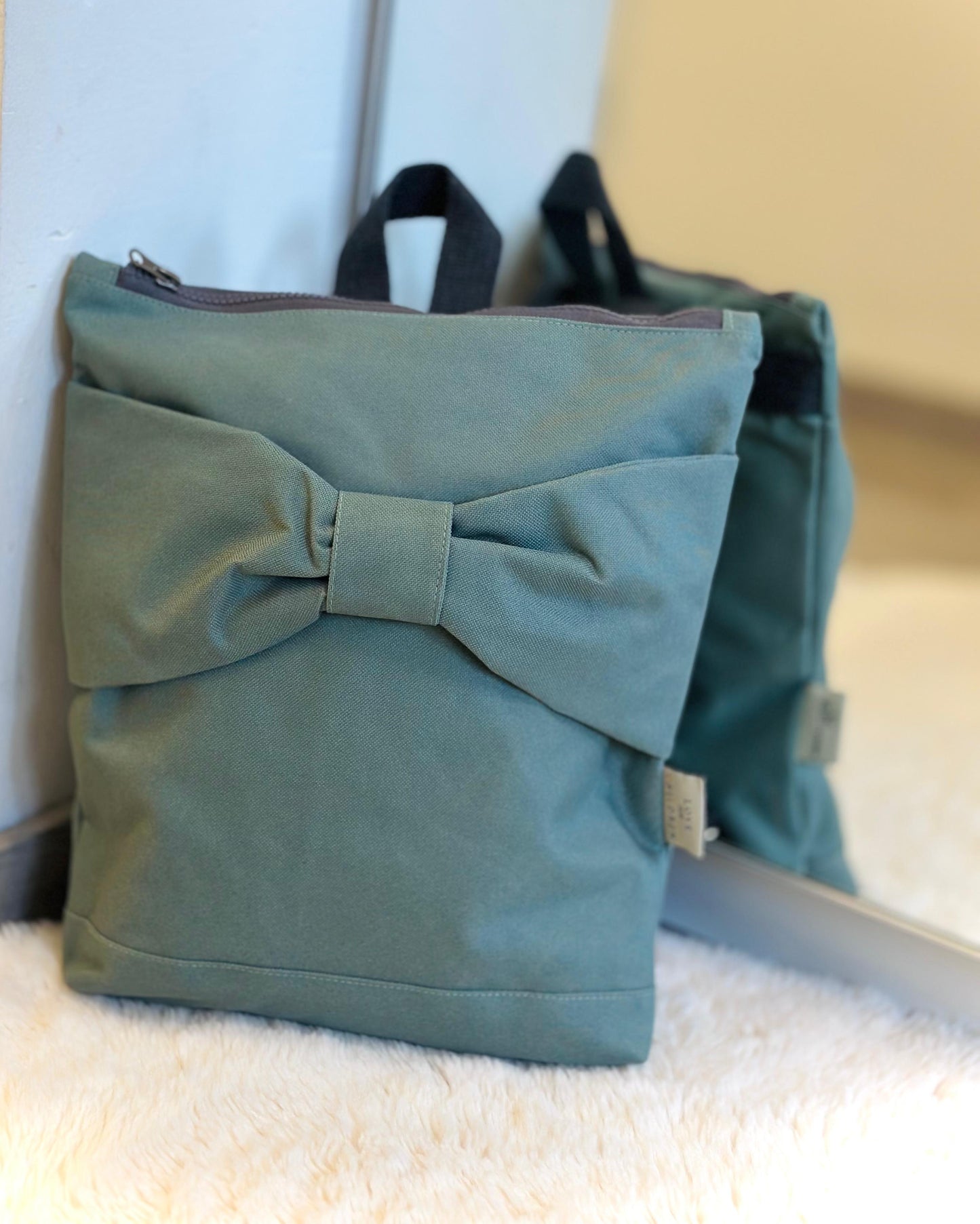 Rugtas kinderen - pastelgroen strik